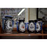 A set of four Continental porcelain royal commemorative vases, largest 22.5cm high.