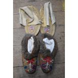 Two pairs of Native American hide slippers.