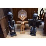 Ethnographica: three tribal carved wood figures, largest 55cm high.