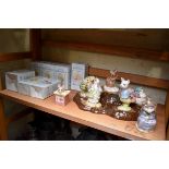 A collection of seven Royal Albert Beatrix Potter figures, each boxed; together with display stand.