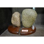 A pair of novelty volcanic rock book ends, each labelled 'Stromboli 1974 M-Y Tamal'.