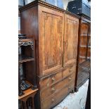 (HP) An early 19th century mahogany linen press, now enclosing hanging space, 127cm wide.