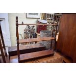 A mahogany three tier open hanging shelf, 57cm wide.