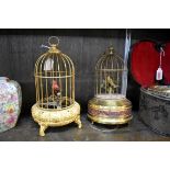 Two old brass singing bird in cage musical automata, largest 27cm high.