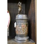 An unusual 19th century Continental pewter and brass tankard, 29cm high.