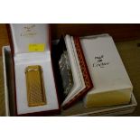 A Must de Cartier gilt lighter, with box and paperwork.