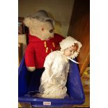 A reproduction bisque head doll, by 'Creations Past'; together with a Paddington bear.