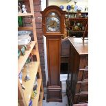 A small mahogany longcase clock, by Elliot, striking on eight straight gongs, 151cm high.