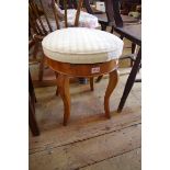 A 19th century fruitwood adjustable piano stool.