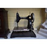 A New Home 'Midget' sewing machine.