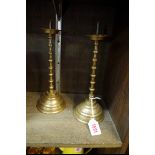 A pair of antique Continental brass pricket candlesticks, 27cm high.