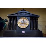 A slate mantel clock, 44cm wide.