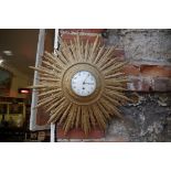 A vintage gilt starburst wall clock, 52cm diameter.