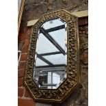 An old brass framed wall mirror, 75.5 x 45.5cm.