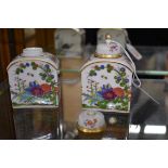 A small pair of Meissen tea canisters and covers, 9cm high, (finial of one restuck).
