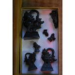 A graduated set of eight Chinese archaistic style bronze weights.