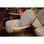 A pair of Ercol blonde occasional armchairs.