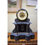 A late 19th century slate and marble mantel clock, 46cm high, with mercury pendulum.