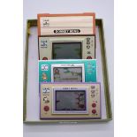 Four Nintendo 'Game & Watch' handheld games, compromising: Donkey Kong JR; Donkey Kong; Snoopy