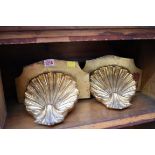 A pair of gilt wood scallop shell wall brackets, 25.5cm wide.