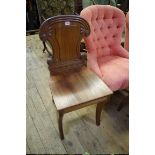 A pair of George IV mahogany hall chairs, in the manner of Gillows.