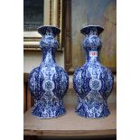 A pair of Dutch Delft vases, 34cm high.