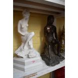 A bronzed female nude, 42cm high, (s.d.); together with another composition marble female nude, on