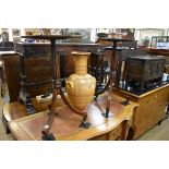 A pair of Regency style mahogany octagonal tripod tables, 41cm wide.