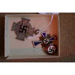 A World War II German 25 years faithful service cross; together with a German Mothers Cross in