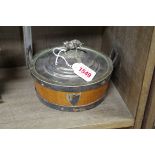 An early 20th century oak and electroplate mounted butter dish and cover.