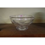 A cut glass circular bowl, finely decorated with a fish, 23cm diameter.