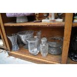 A small group of clear glass vases, bowls and similar.