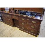 A George III oak dresser base, with kneehole cupboard, 219cm wide.