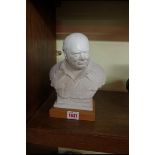 After Oscar Nemon, a plaster bust of Sir Winston Churchill, on wood base, total height 22.5cm.