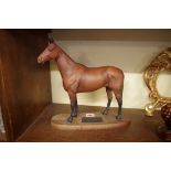 A Beswick figure of 'Arkle', on wood plinth, 30cm high.