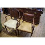 A Regency mahogany sabre leg elbow chair; together with another George III mahogany elbow chair.