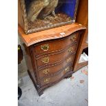 A small reproduction burr walnut and crossbanded serpentine fronted chest of drawers, 49cm wide.