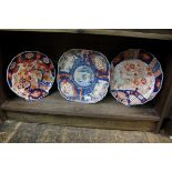 Three Japanese Imari plates, two of scallop form, largest 25.5cm wide.