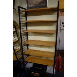A vintage Ladderax style modular bookshelf.