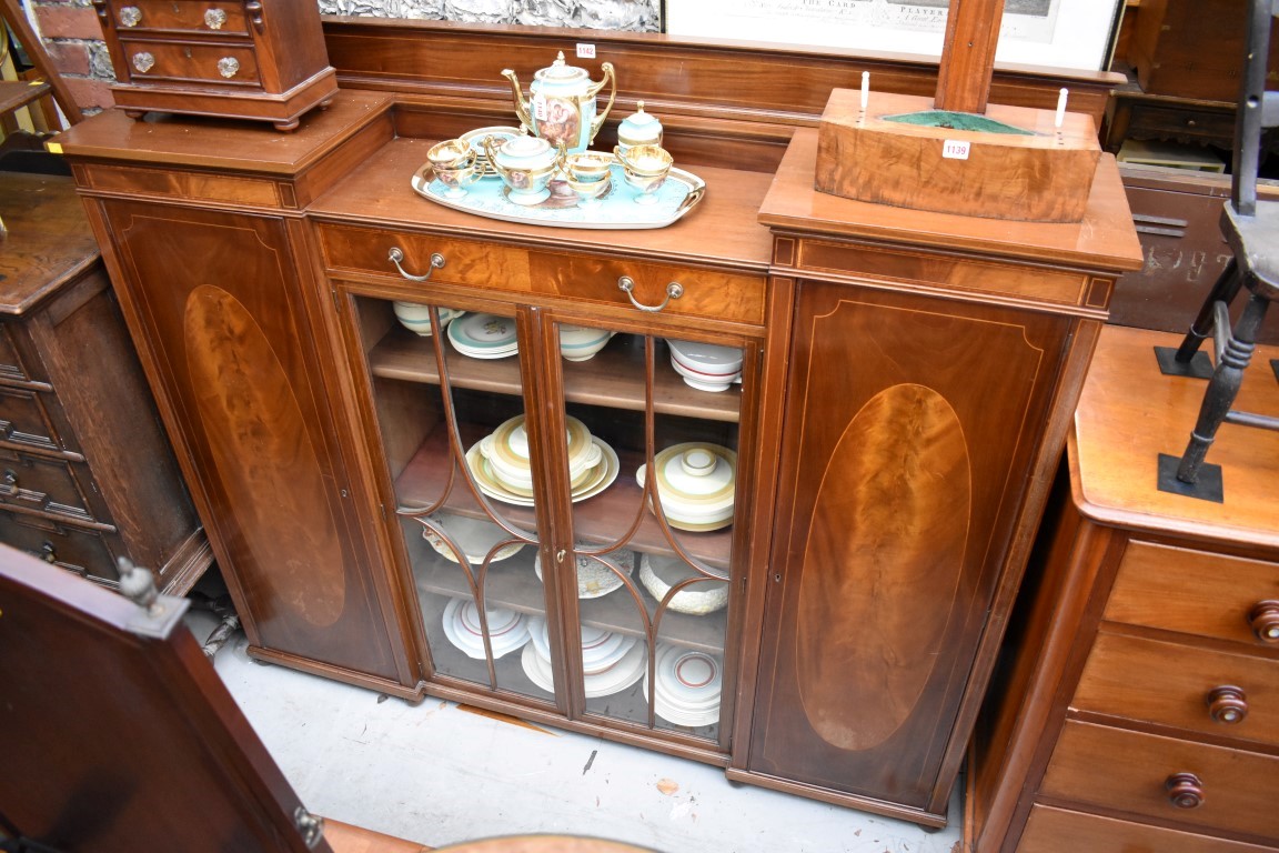 A mahogany and inlaid inverted breakfront side cabinet, 169.5cm wide.