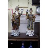A large pair of Chinese glazed and biscuit fired figures, largest 48cm high.