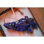 A Chinese carved lapis lazuli fish pendant, 6.5cm long.