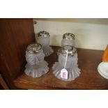 A set of four moulded clear frosted glass light shades.