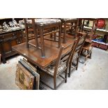 An Ercol dining suite, comprising a draw leaf table, 137.5cm when closed; a dresser and rack,