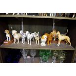Eight Beswick dogs; together with a Beswick Barn Owl.
