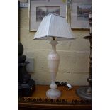 An alabaster table lamp, height including shade 63cm.