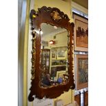 An 18th century style walnut and parcel gilt framed pier mirror, 92.5 x 55.5cm.