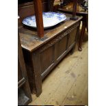 A late 17th century oak panelled coffer, 110cm wide.