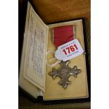 Medals: a cased George V MBE.