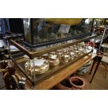 A brass and glass low rectangular two tier occasional table, 130.5cm wide.